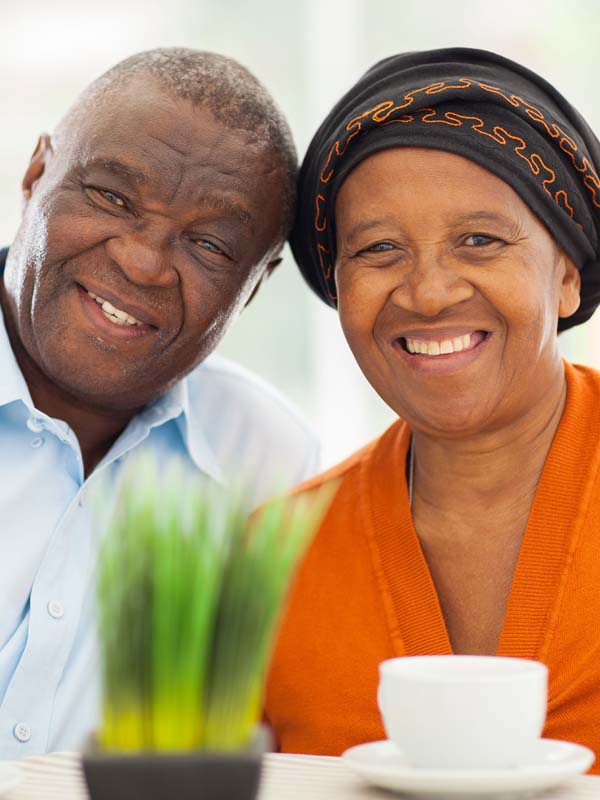 Portrait of Smiling and Hopeful Senior Couple after visiting Scout Advocacy